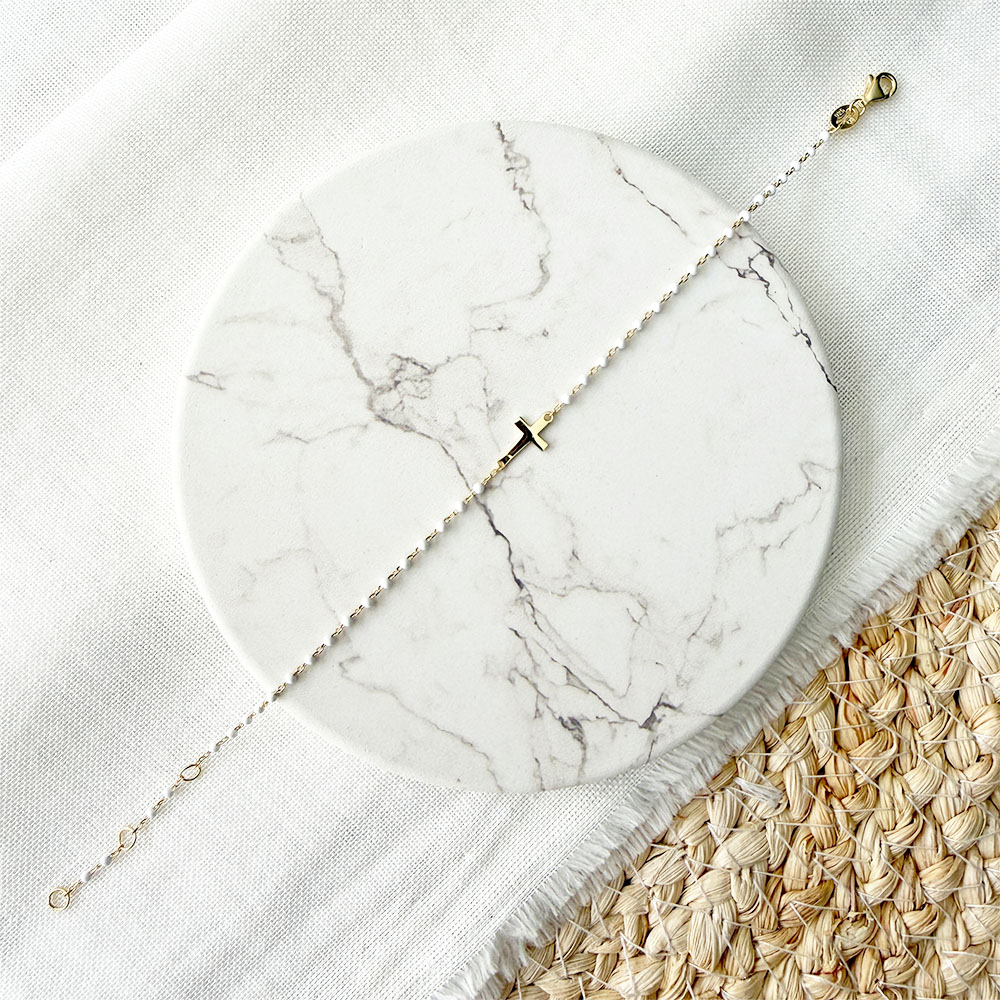 P074 PULSERA CRUZ PIPOS BLANCO